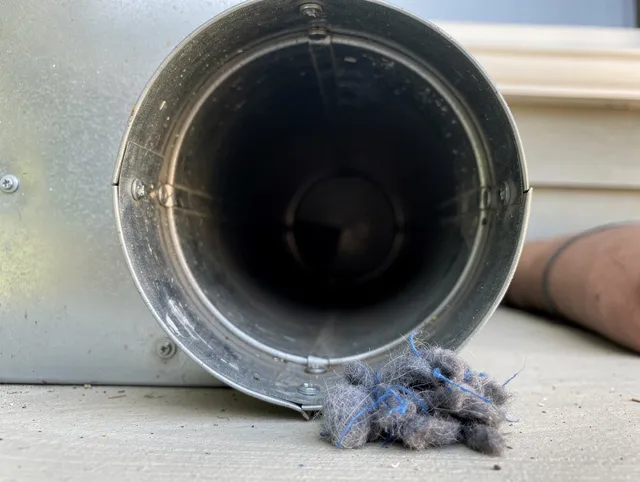 Ravenna Dryer Vent Cleaning technician using specialized equipment to clear severe dryer vent blockage in Ravenna